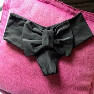 Lolli cheeky bow back black swim bottoms